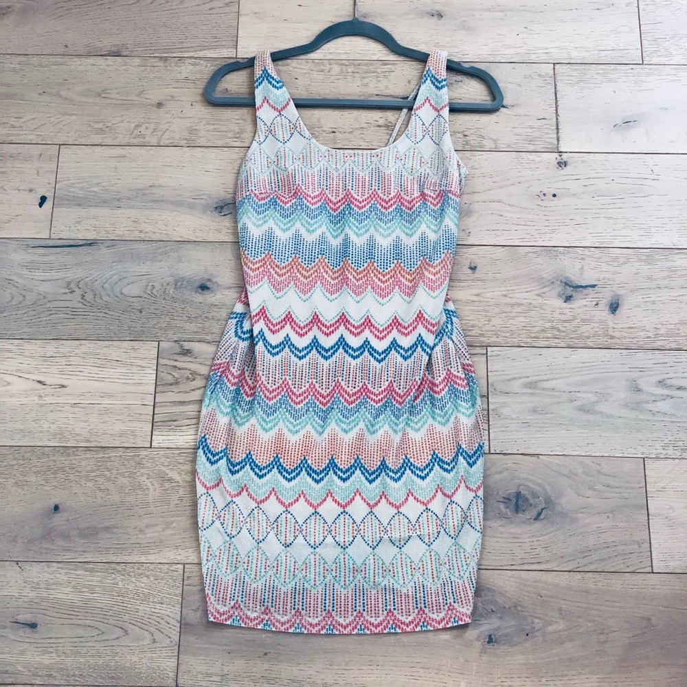 Vintage bodycon dress with bead-like detail.